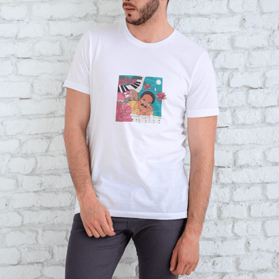 Man wearing Timeless SPB graphic T-shirt against brick wall